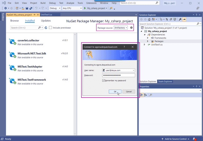 VS 2019 displaying the NuGet Package Manager with the package-source set to Artifactory, and the Connect to agora.dequecloud.com log-in modal populated with credentials. The Remember my password box on the log-in modal is checked.
