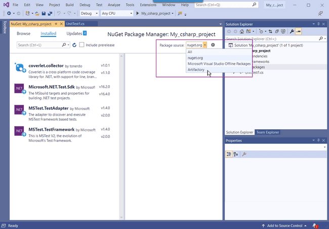 VS 2019 displaying the open NuGet Package Manager. The package source list is opened to display four options: all, nuget.org, Microsoft Visual Studio Offline Packages, and Artifactory. Artifactory is selected